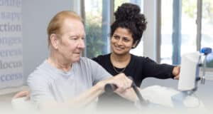 A physical therapist helping an elderly man so therapy at Sunnyvale Post Acute